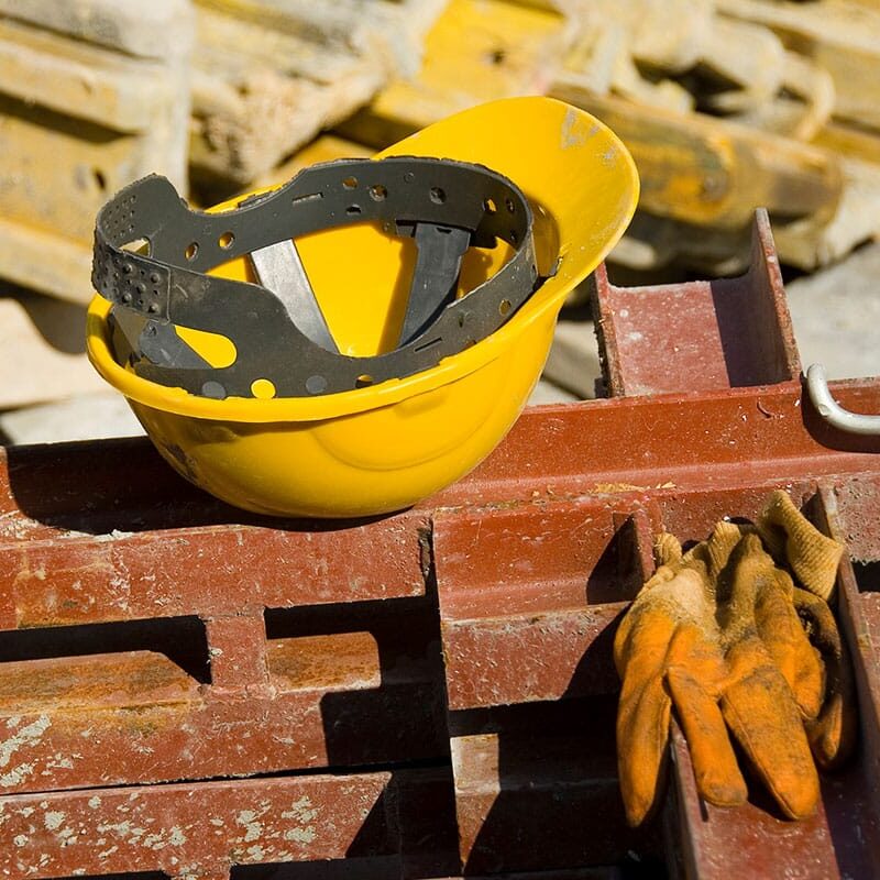 hat and gloves at a construction site in Los Angeles that is at risk for causing potential personal injury to the workers