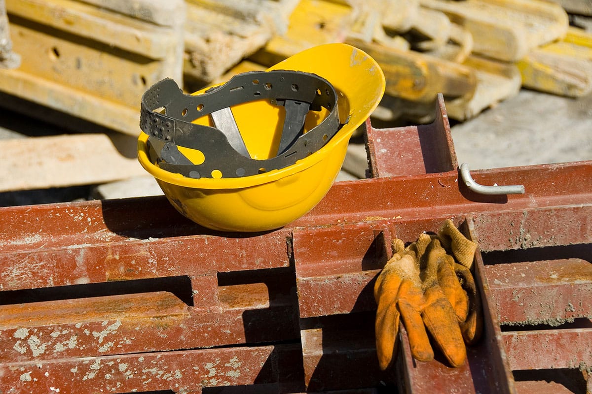 hat and gloves at a construction site in Los Angeles that is at risk for causing potential personal injury to the workers