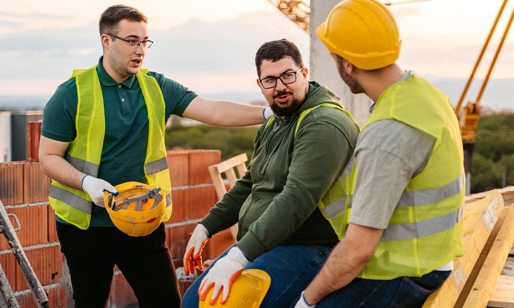 workers on a San Diego construction site discussing a personal injury