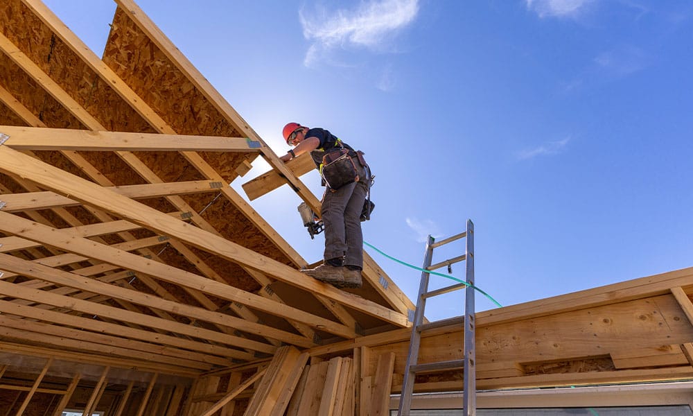 construction worker fixing previous property damage in Los Angeles