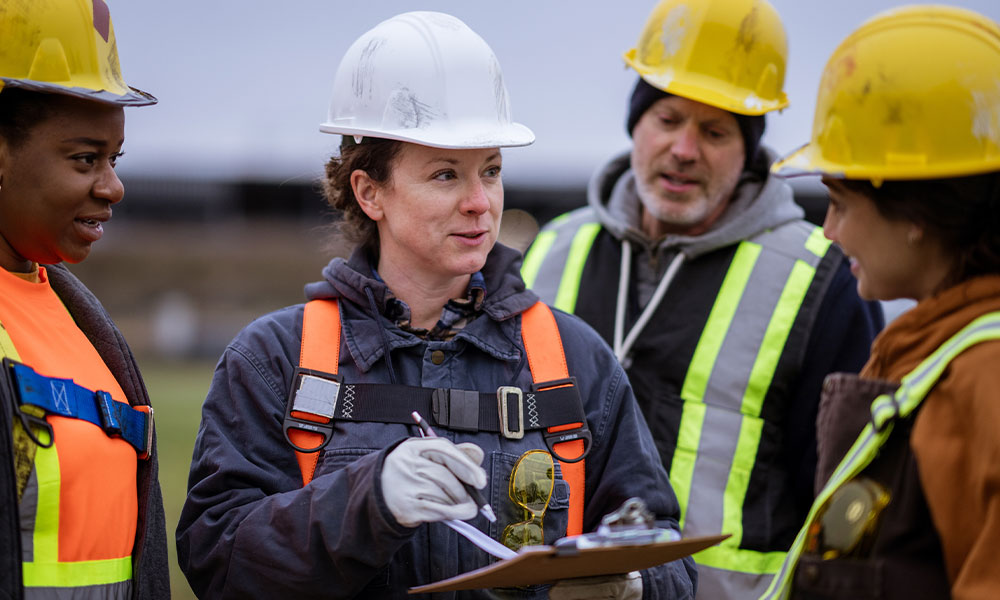 workers discussing the legal safety regulations and standards on a san diego construction site