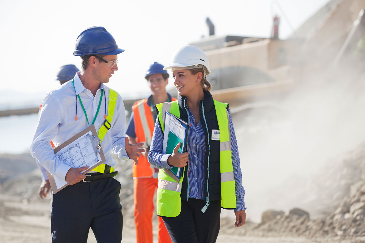 workers inspecting legal regulations on a san diego construction site