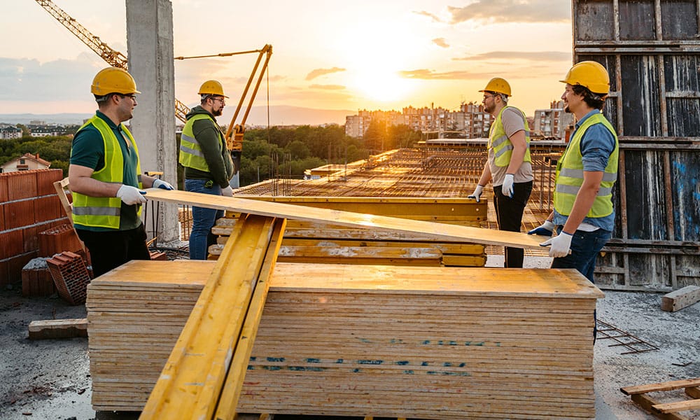 workers complying with environmental real estate laws on a construction site in San Diego