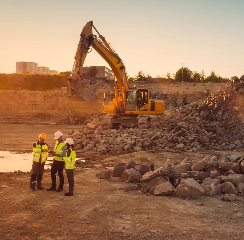 workers on a construction site in San Diego discussing real estate laws