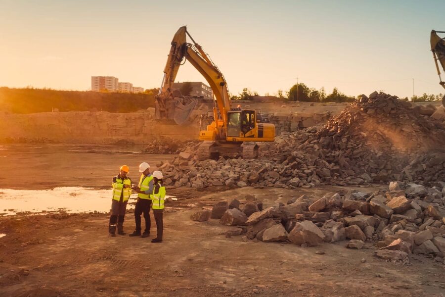 workers on a construction site in San Diego discussing real estate laws