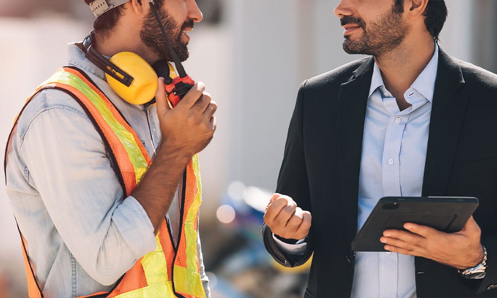 construction worker and lawyer talking in Los Angeles