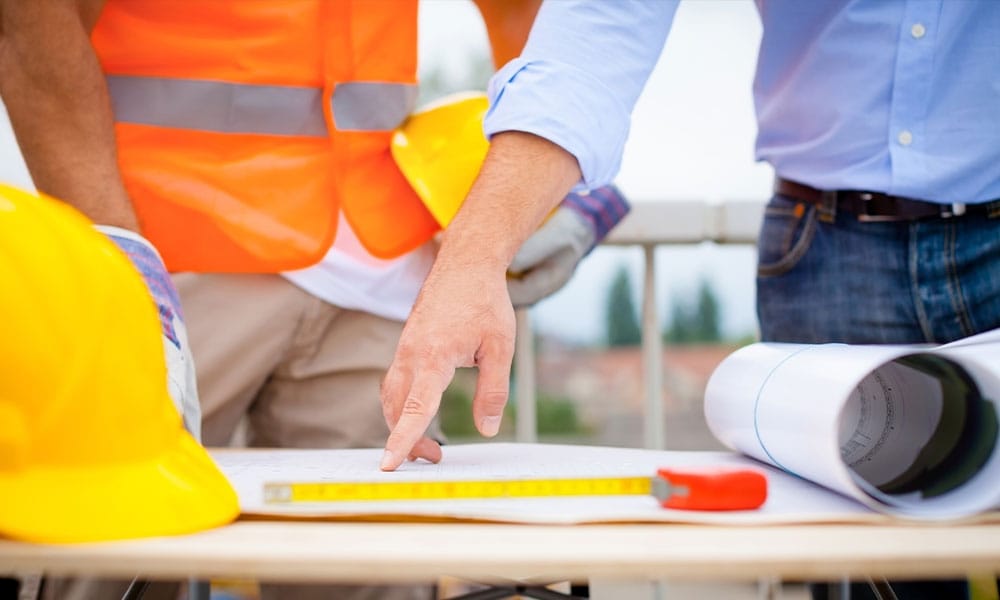 construction workers discussing a defect in san diego