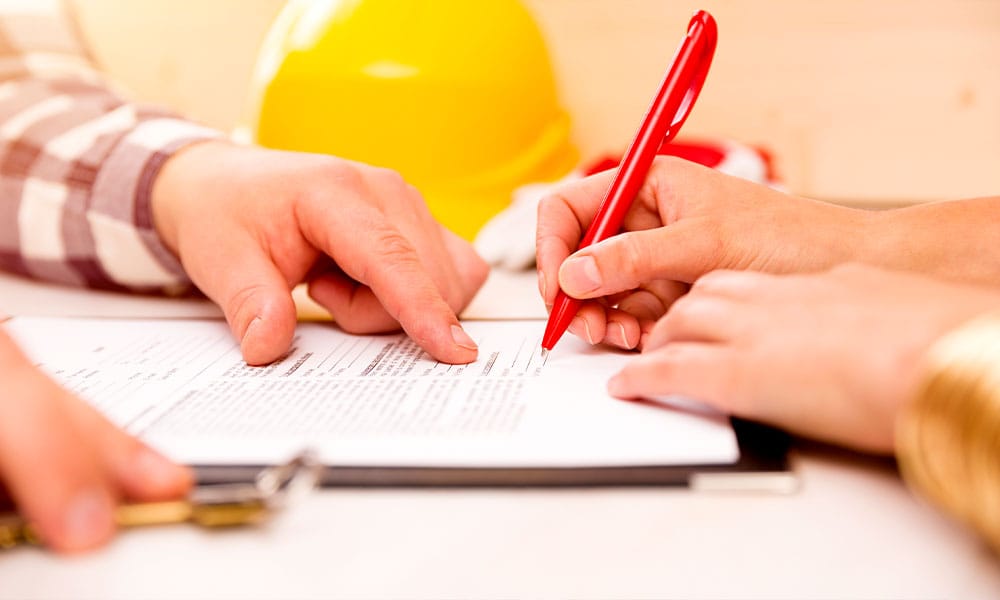 worker and lawyer signing a construction project contract in Los Angeles, CA