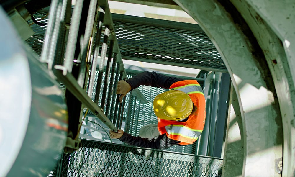 worker climbing a ladder before falling on a construction site in Los Angeles, CA