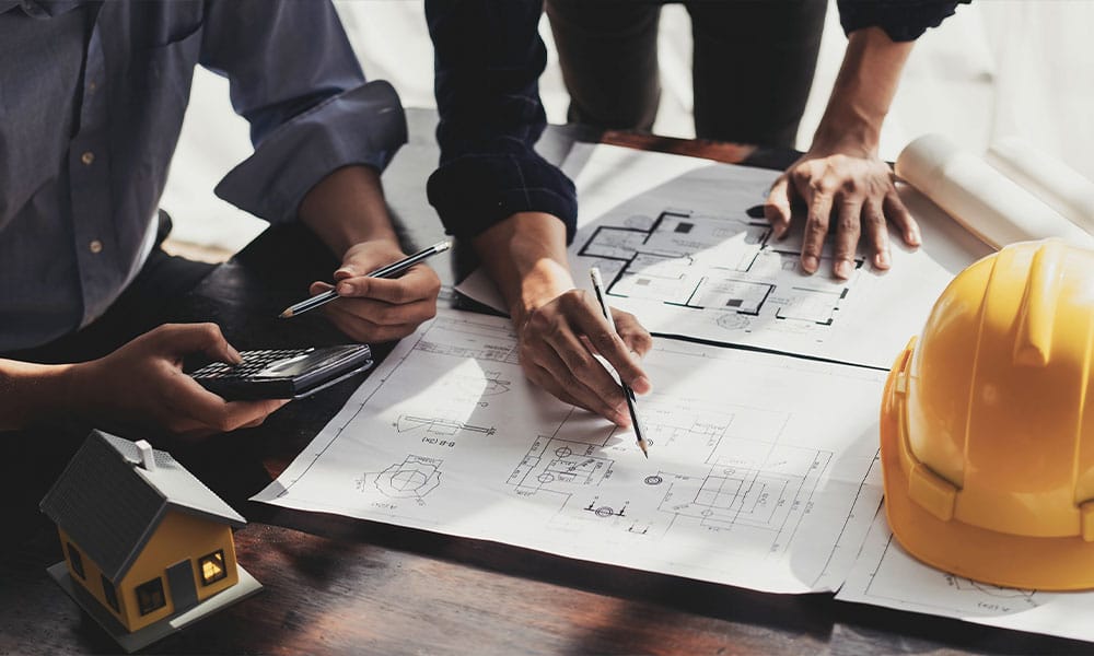 workers discussing a construction contract in San Diego, CA