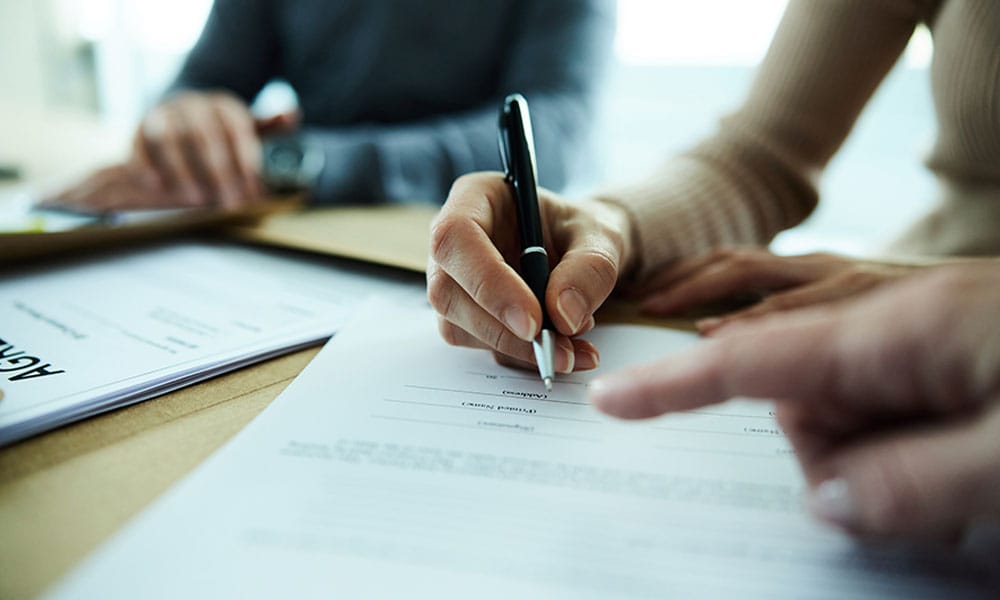 client and lawyer discussing a commercial lease dispute in San Diego, CA