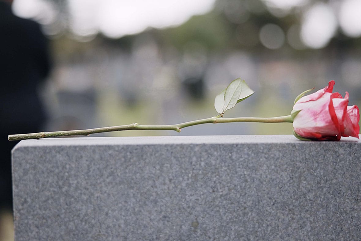 rose on a gravestone after a construction fatality in San Diego, CA