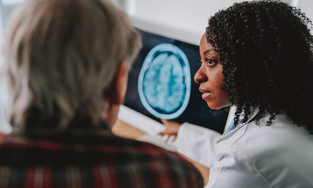 doctor reviewing a traumatic brain injury scan from a construction site in Los Angeles, CA